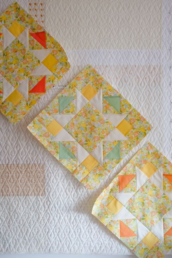 3 colorful quilted blocks of fabric